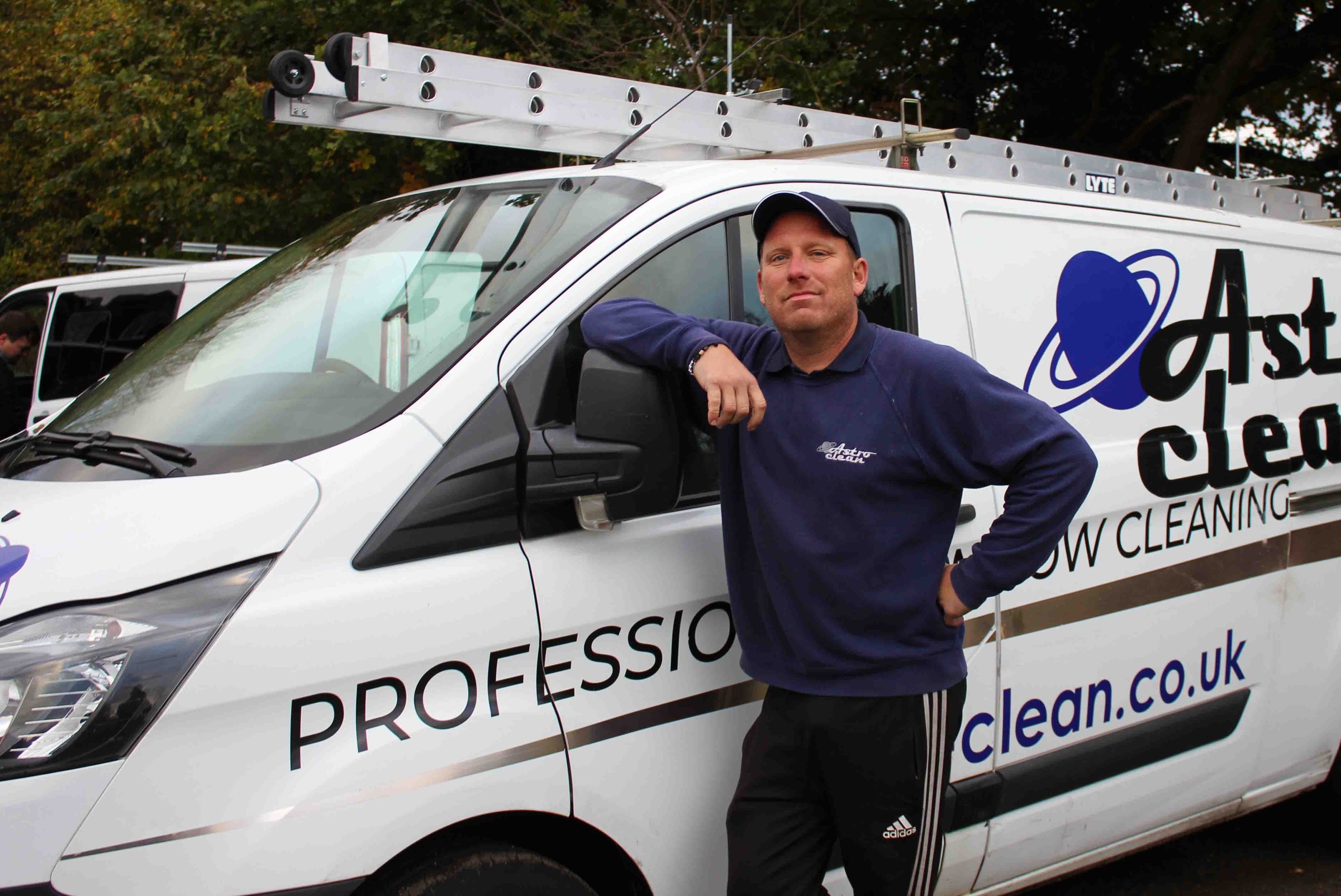 Andy from Astro Clean with branded van and ladder